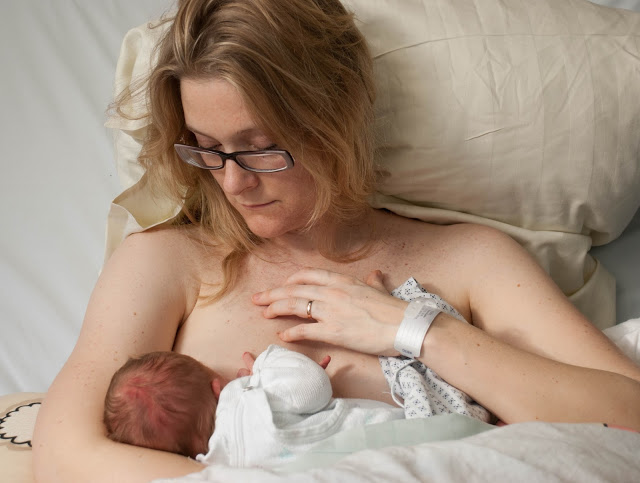 Doctor Anne holding her first born daughter