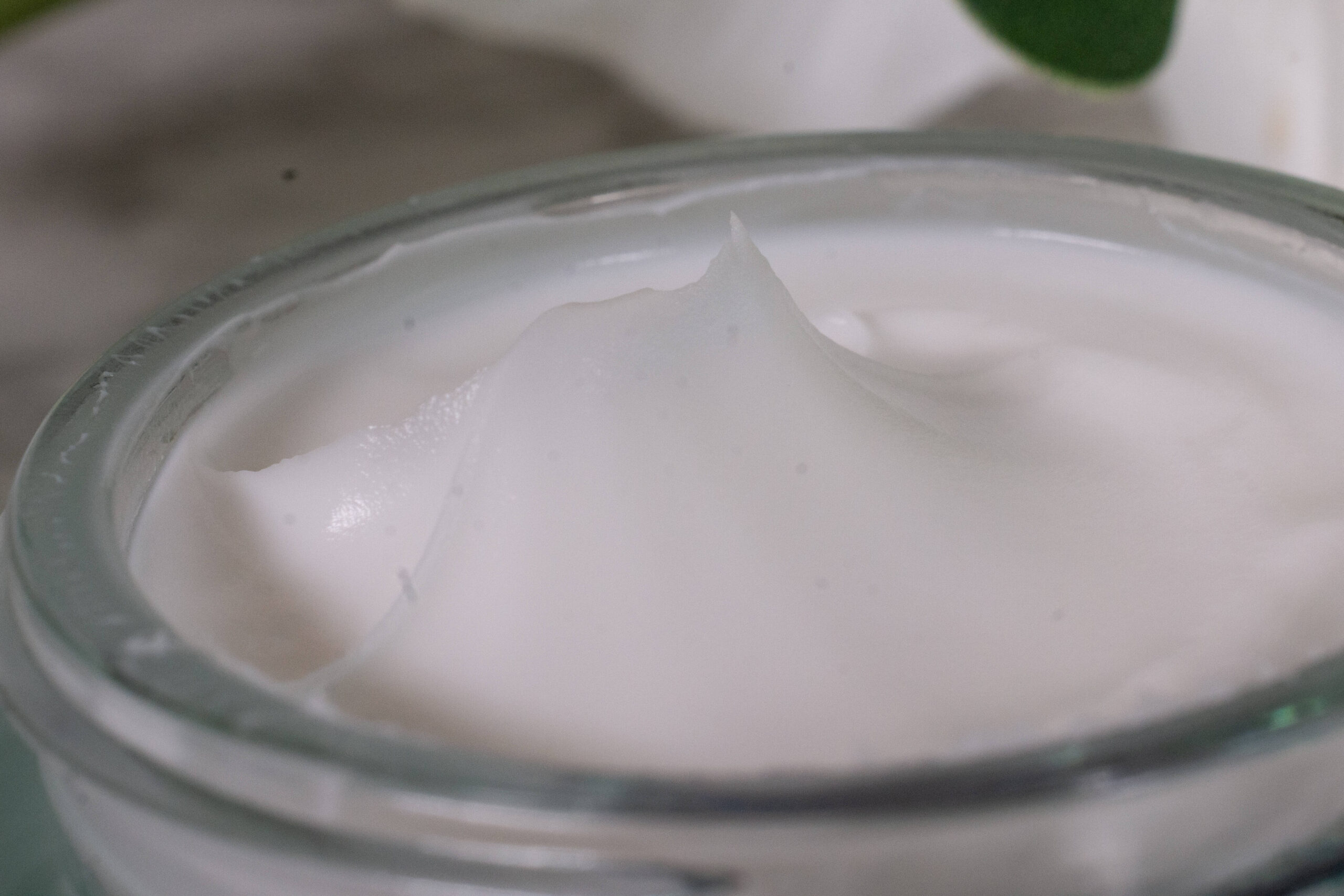 Close up of the BIOSSANCE Squalane + Omega Repair Cream, a rich, white cream