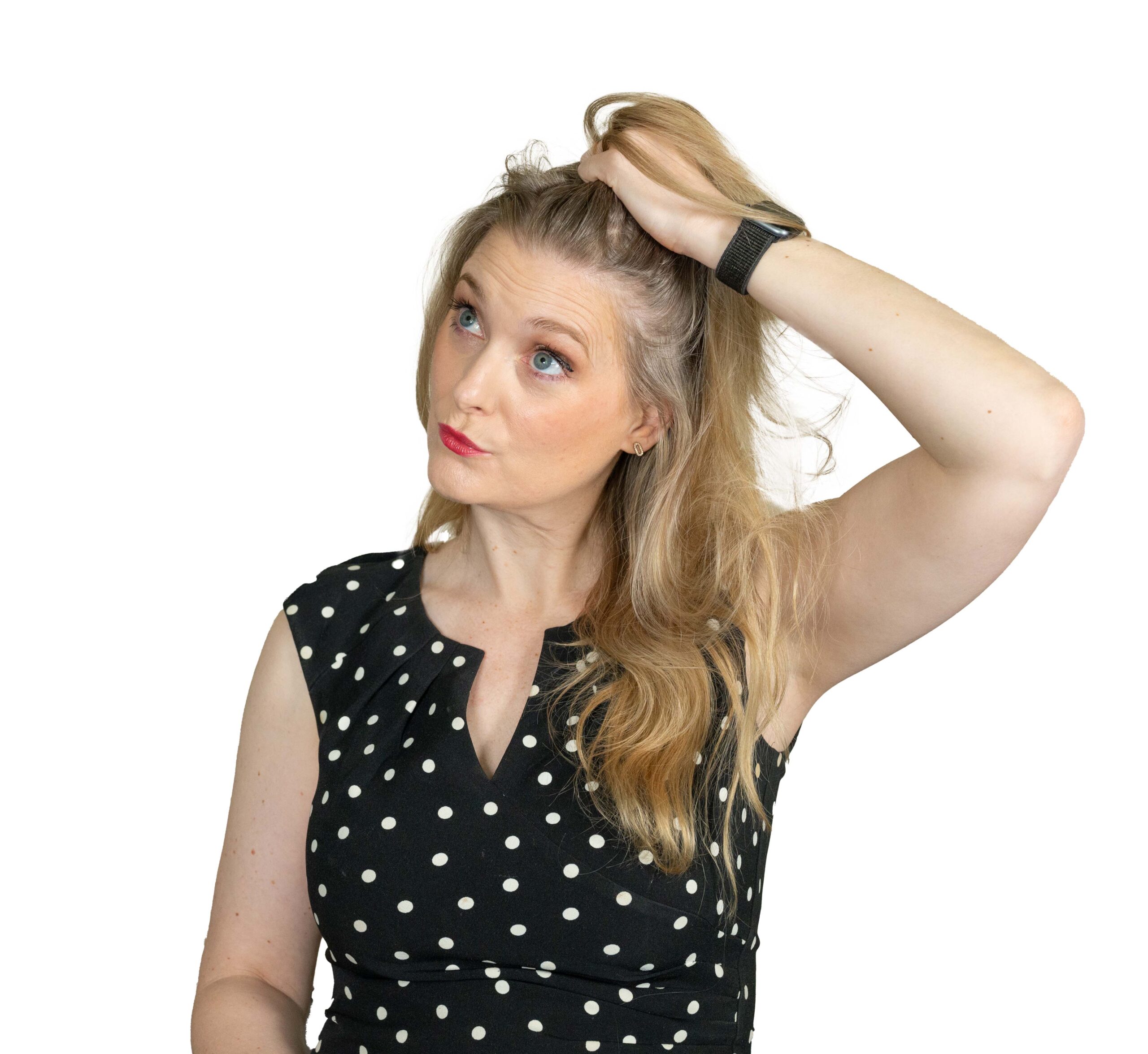 Blonde Woman checking if her hair has changed in any way (part of the article: Low Level Laser Therapy for hair growth or hair loss)