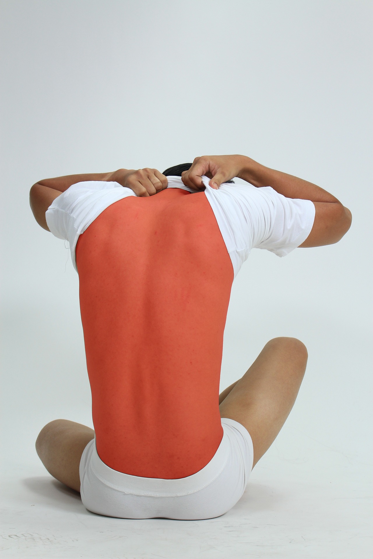 Man with a completely red back