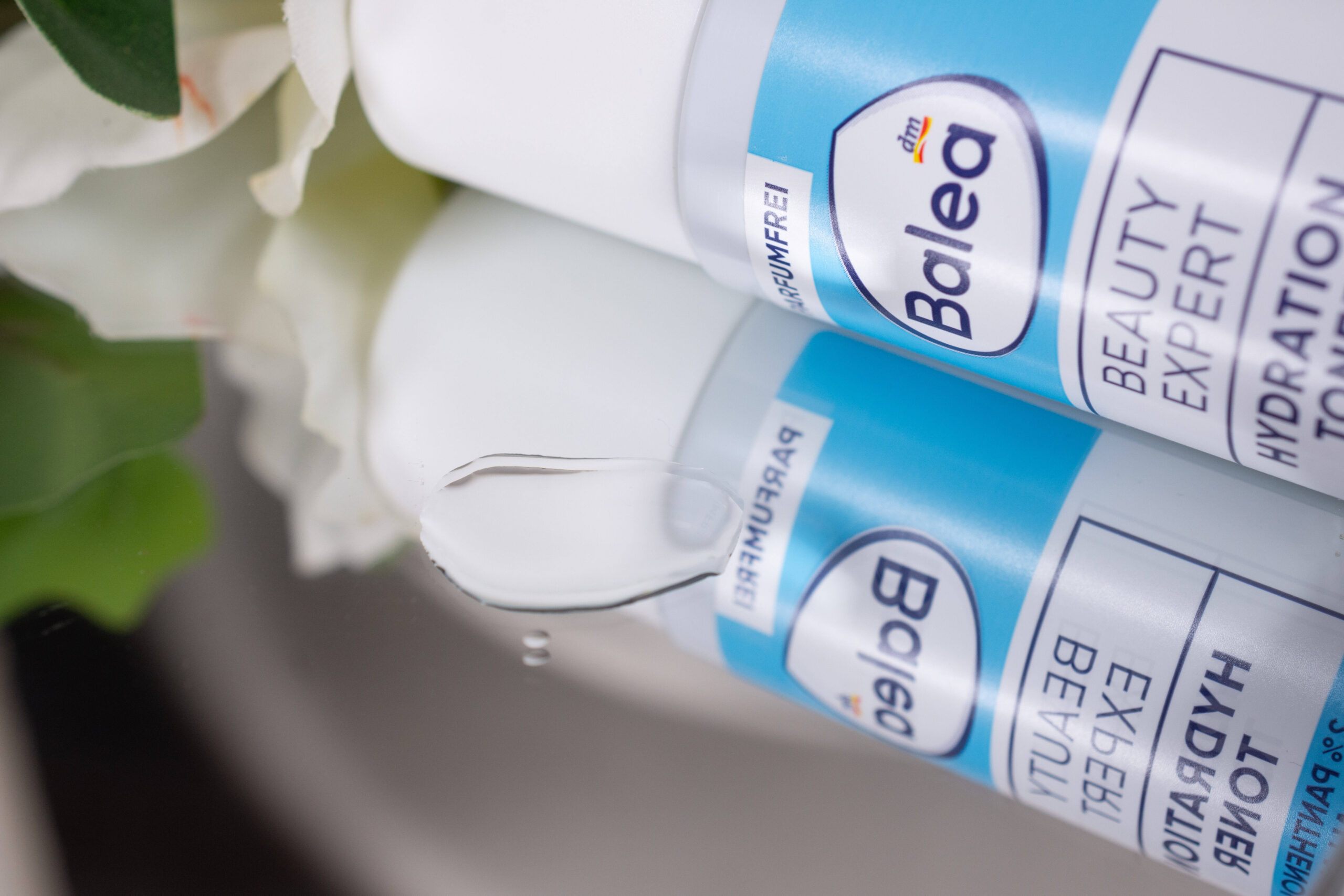 A close up of the Balea Beauty Expert Hydration Toner on a mirrored surface.