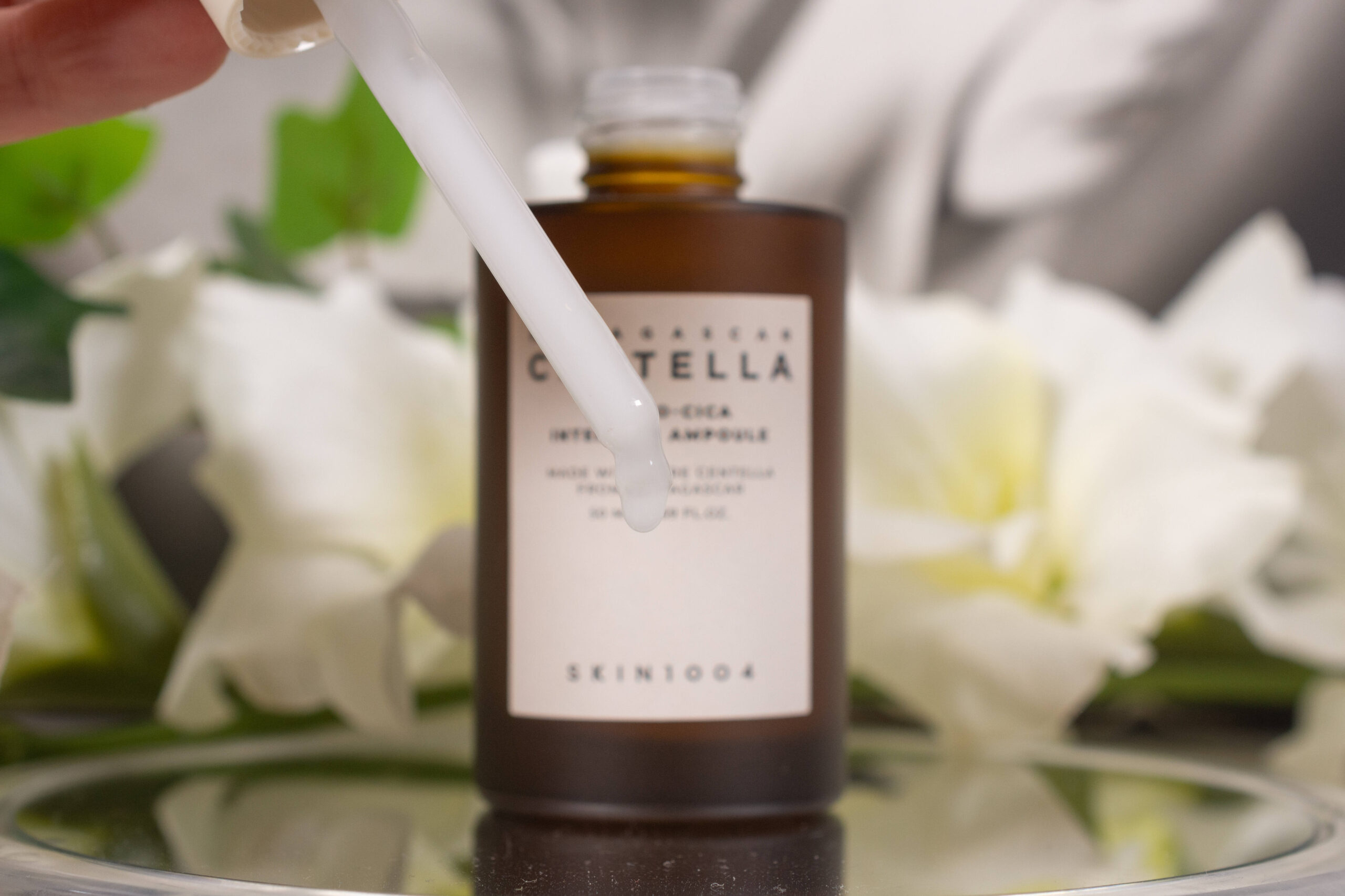 Close up of the SKIN1004 Probio Cica Intensive Ampoule, a milky white lotion.