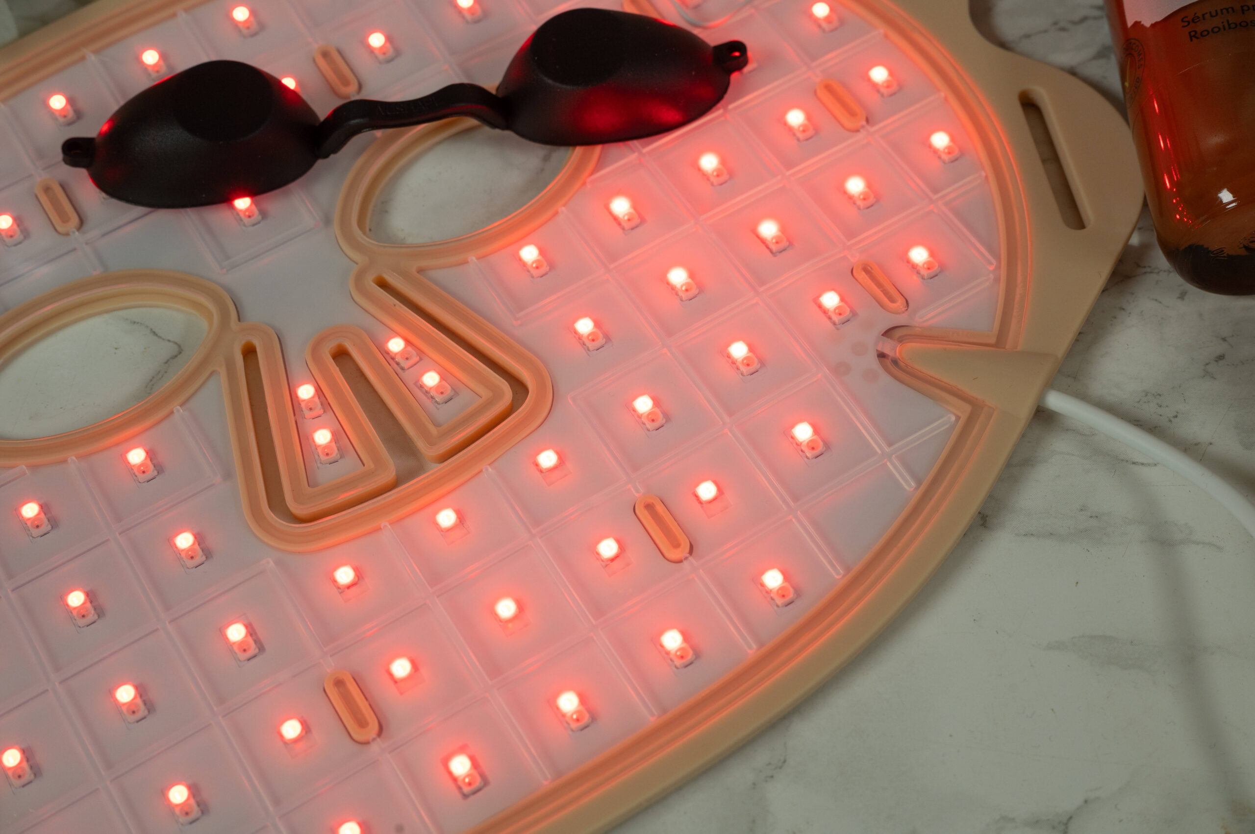 Close up of the lamps of the Maysama Prana LED Light Therapy Mask with the red light turned on